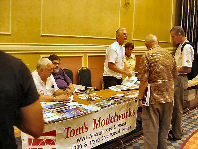 Tom-Harrison-talking-and-Gary-Kingzett---sitting-in-white-shirt