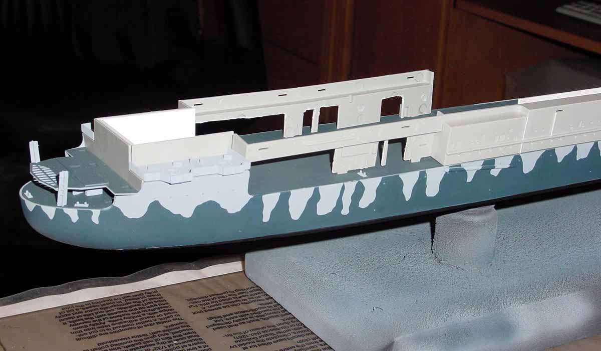 The hangar deck and forecastle were added to the hull along with various de...