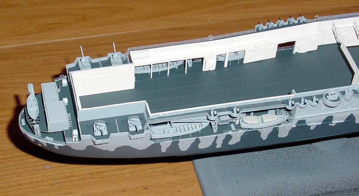 The hangar deck and forecastle were added to the hull along with various de...